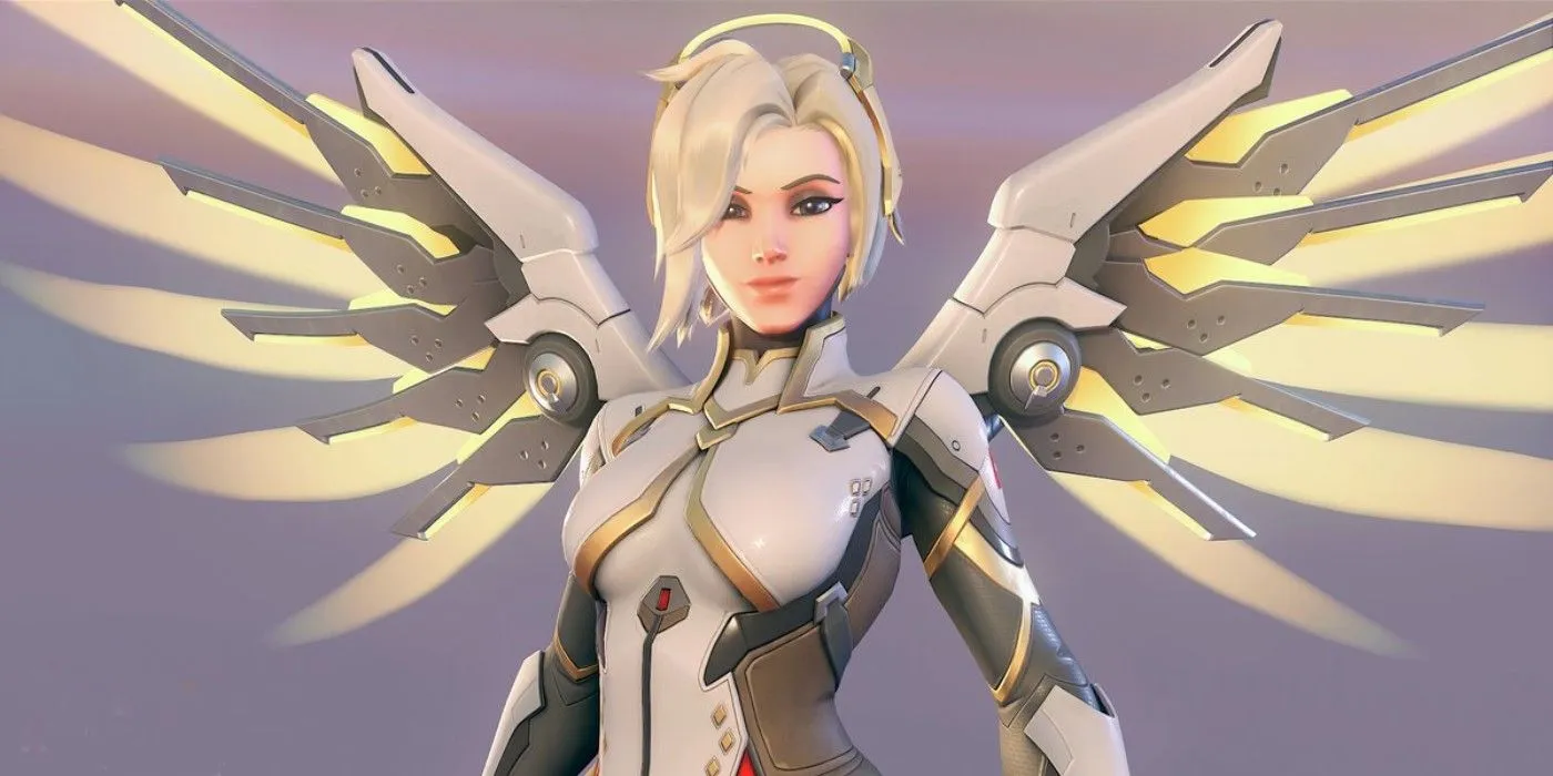 Mercy, una sanadora de Overwatch 2, mira a la cámara y sonríe con sus alas mecánicas extendidas hacia afuera.