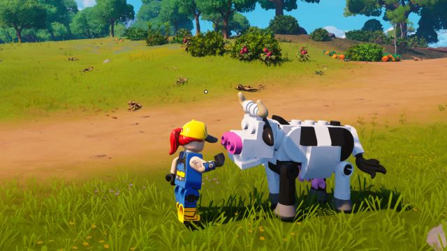 Un jugador acariciando una vaca en LEGO Fortnite.